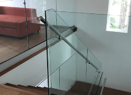 Custom frameless glass railing installation in a Miami home